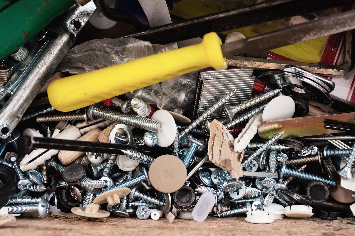 Nuts and screw and other material and tools in toolbox - hand tool material background concept photo