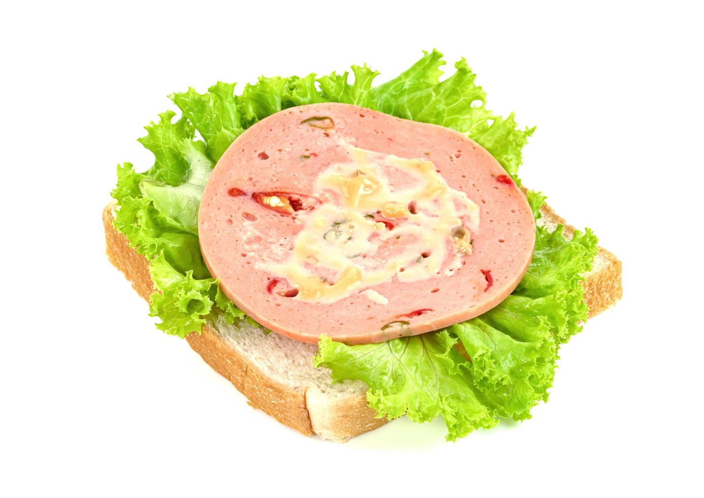 bologna sliced with bread and lettuce leaf isolated on white background photo