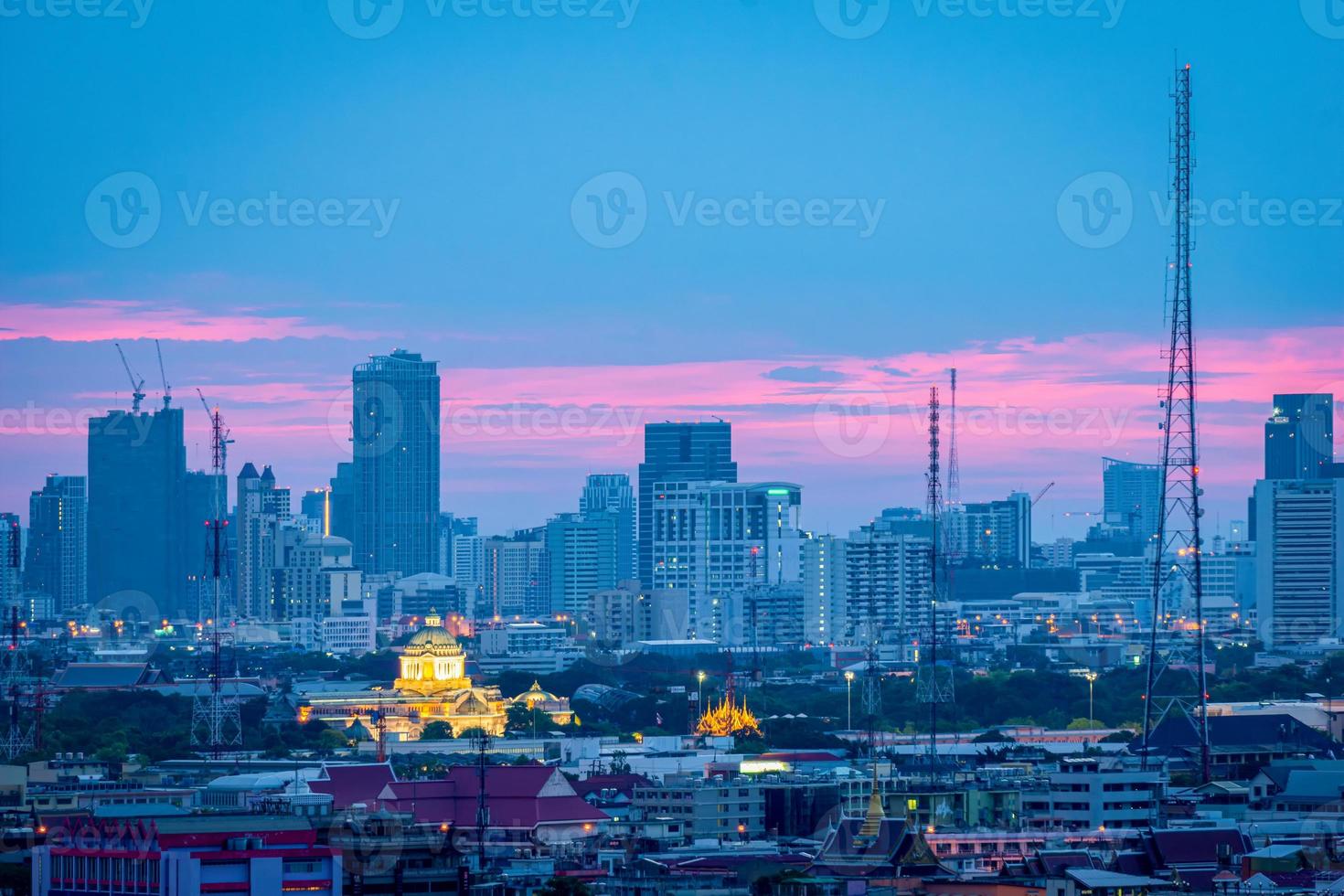 High rise office building The city centre of Bangkok. At dawn, the light from the sky is blue and orange. photo