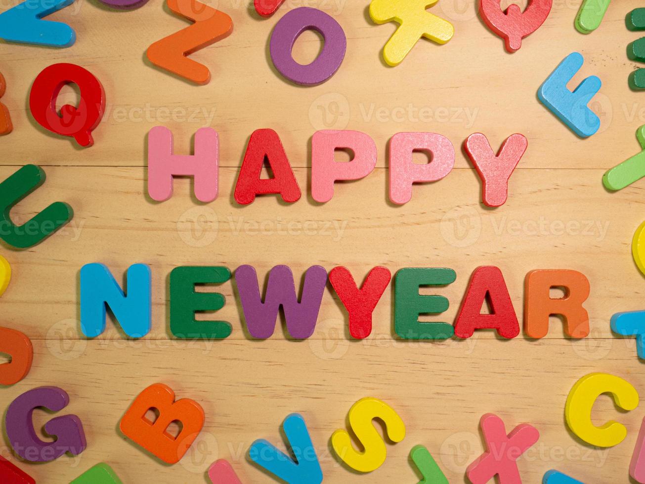 The happy new year on  wood texture for background concept photo