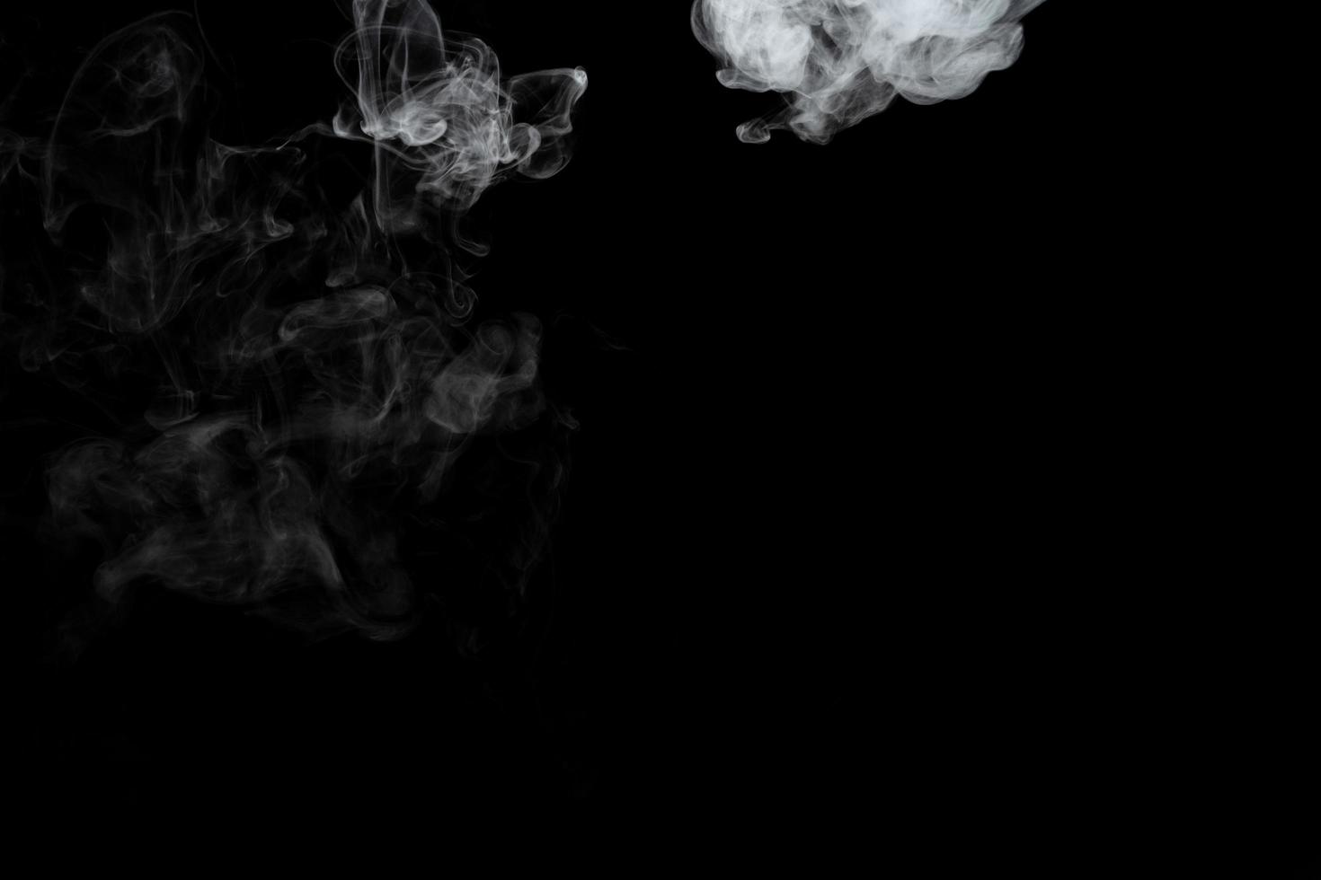 Abstract powder or smoke effect isolated on black background photo