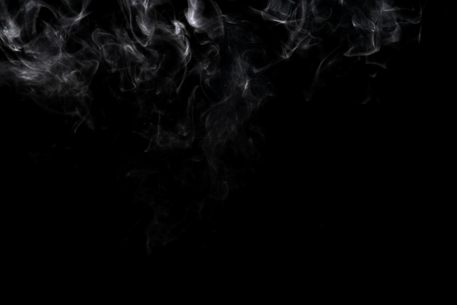 Abstract powder or smoke effect isolated on black background photo