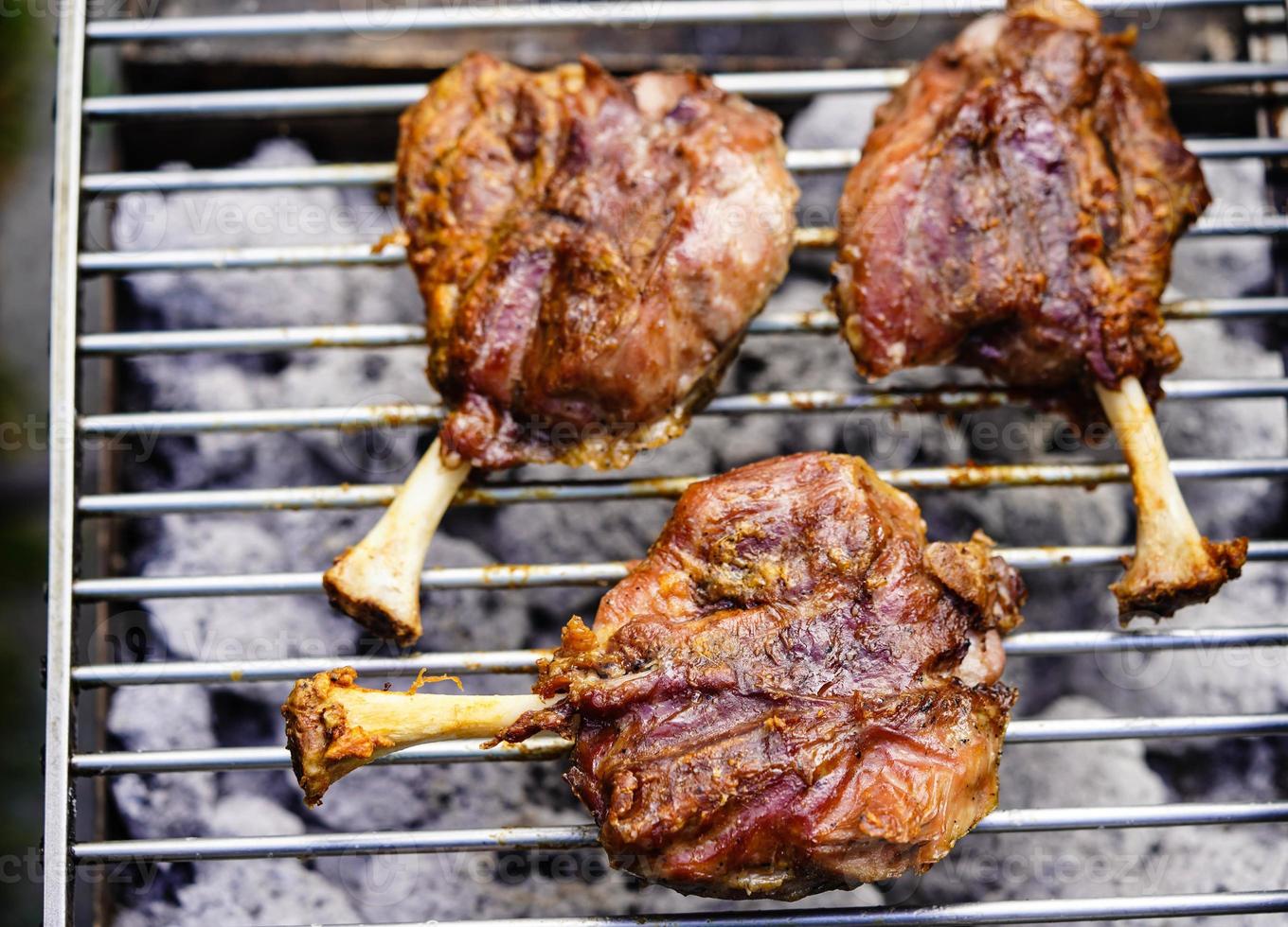 grilled pig wings - sliced open pork knuckle of a young pig photo