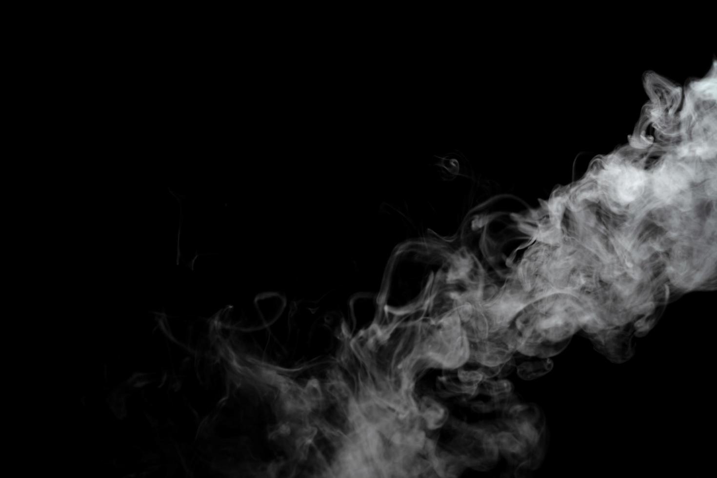 Abstract powder or smoke effect isolated on black background photo