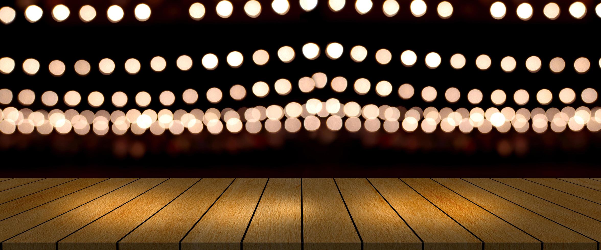 top desk with blur restaurant background,long wooden table and blurred bokeh of night street background photo