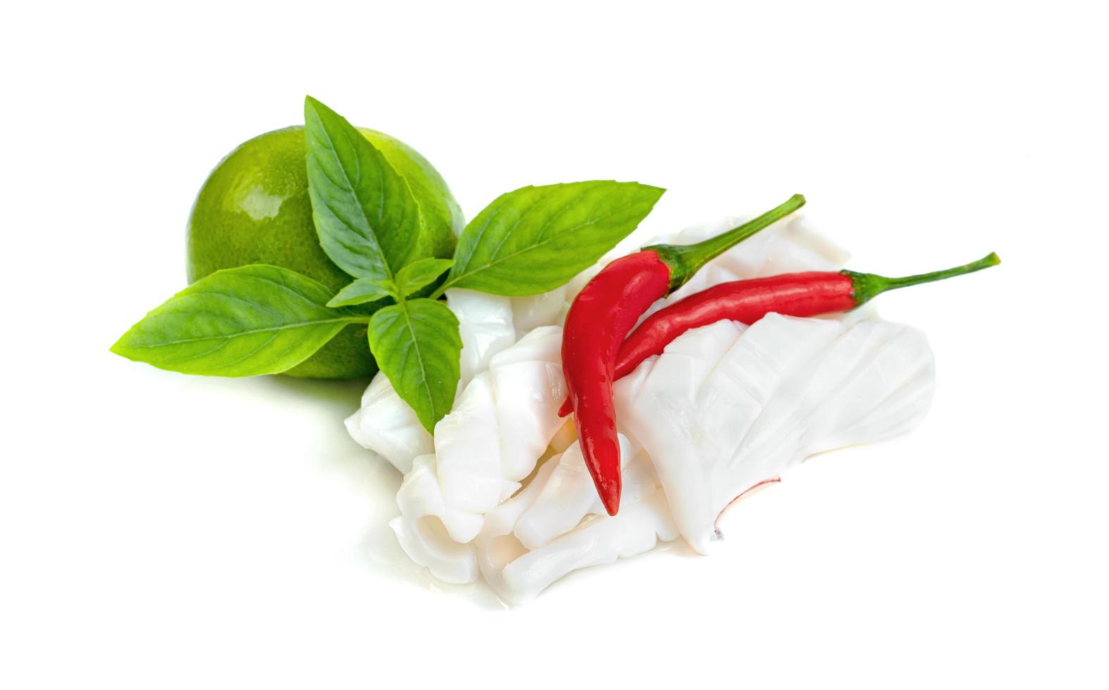 Boiled squid with chili and lemon and basil isolated on white background photo