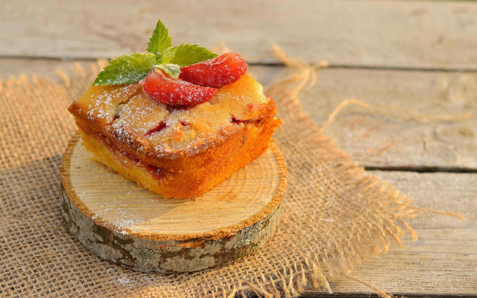 Delicious summer dessert strawberry pie, sweet delicious festive cake with strawberries on a round stand photo