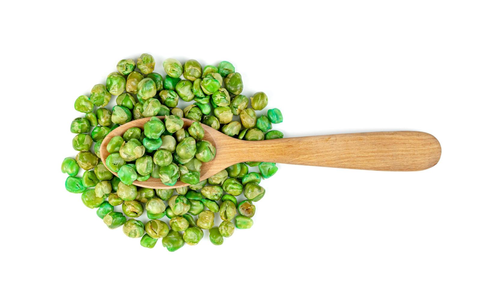 Green peas roasted with wooden spoon isolated on white background photo