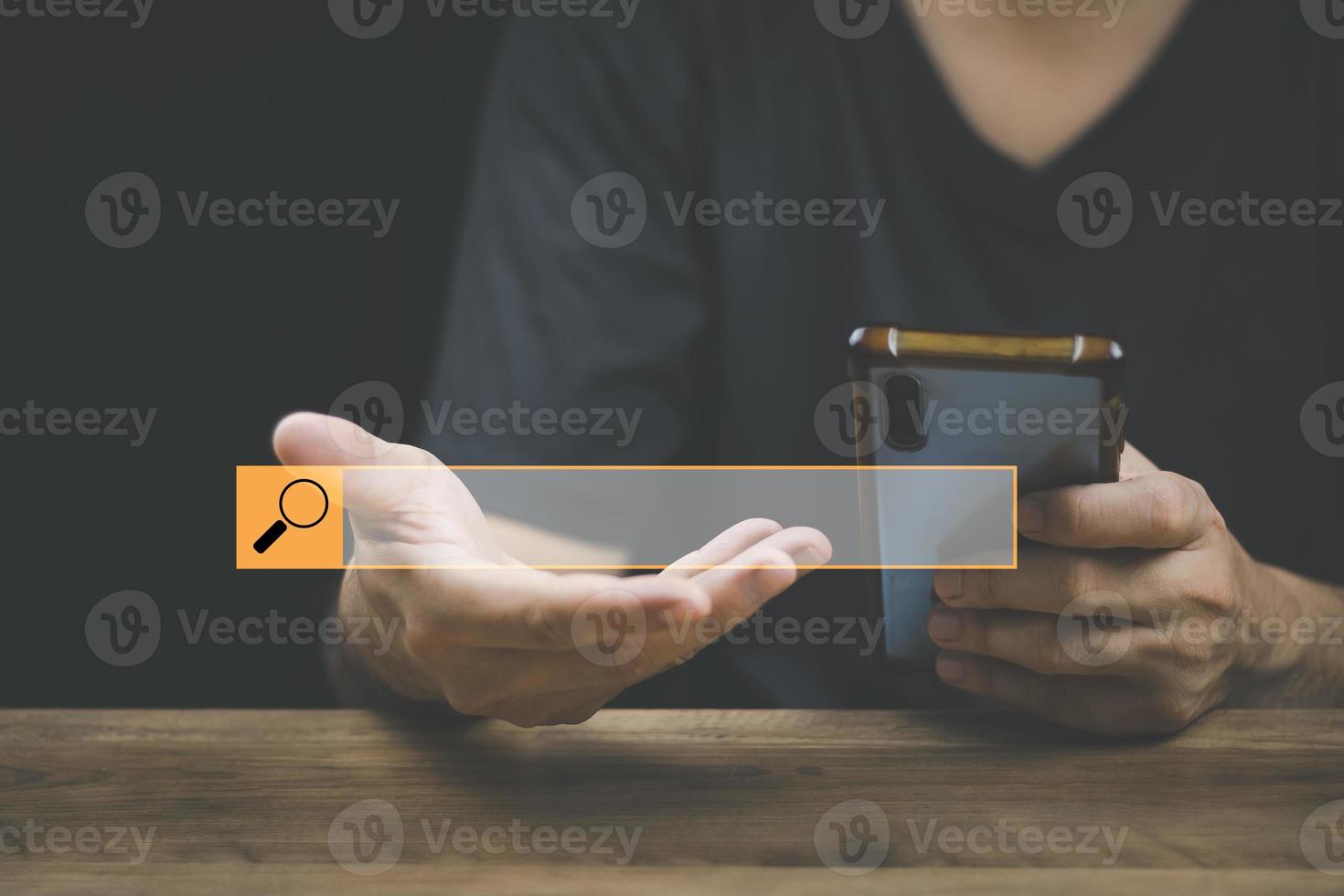 The concept of using technology to search for information, a man's hand is using a smartphone to search for information on social media via the Internet online. photo