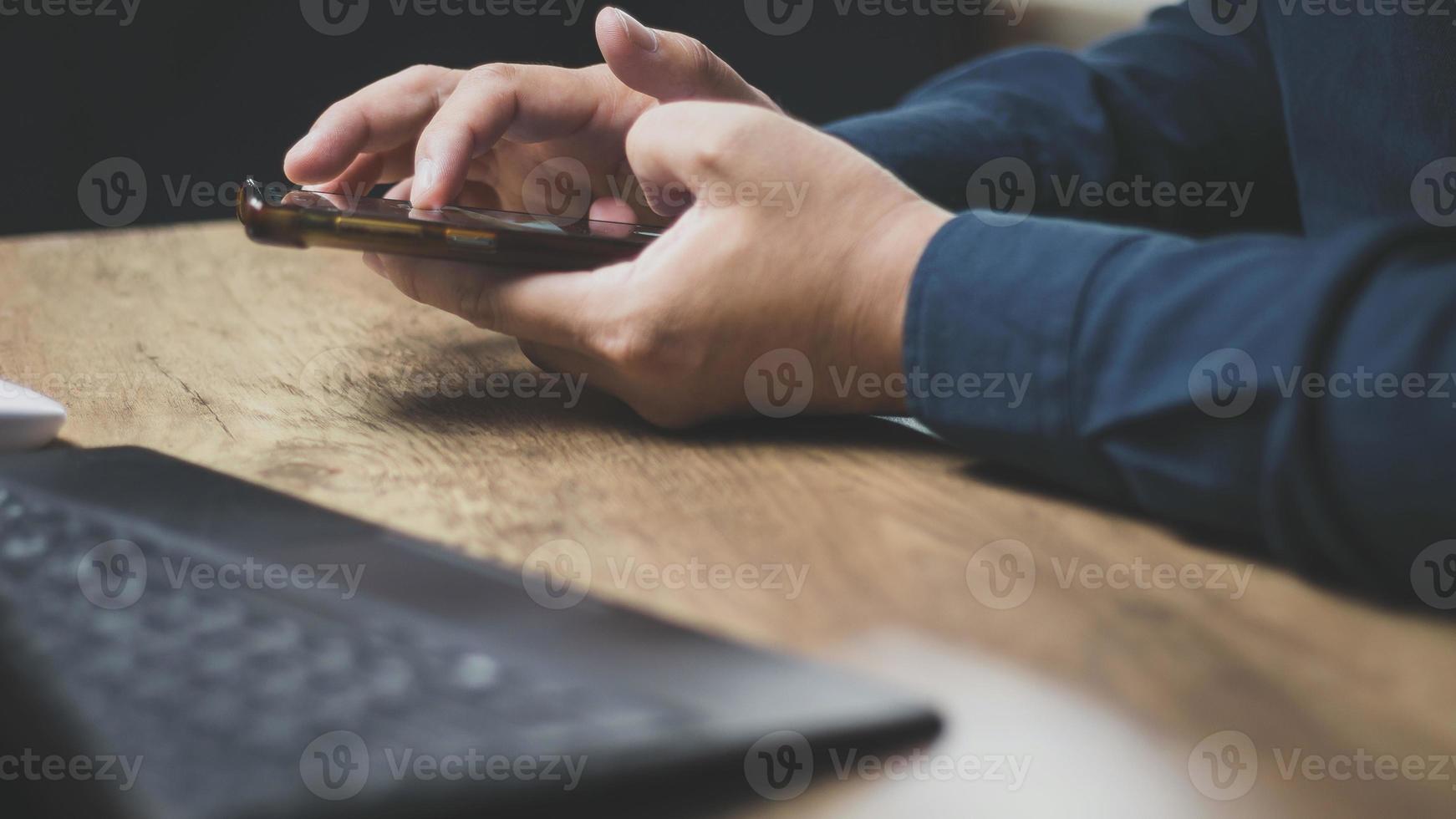 echnology concept social media man using smart phon access online media Through the Internet, there is marketing to answer customer chats. by working at home photo