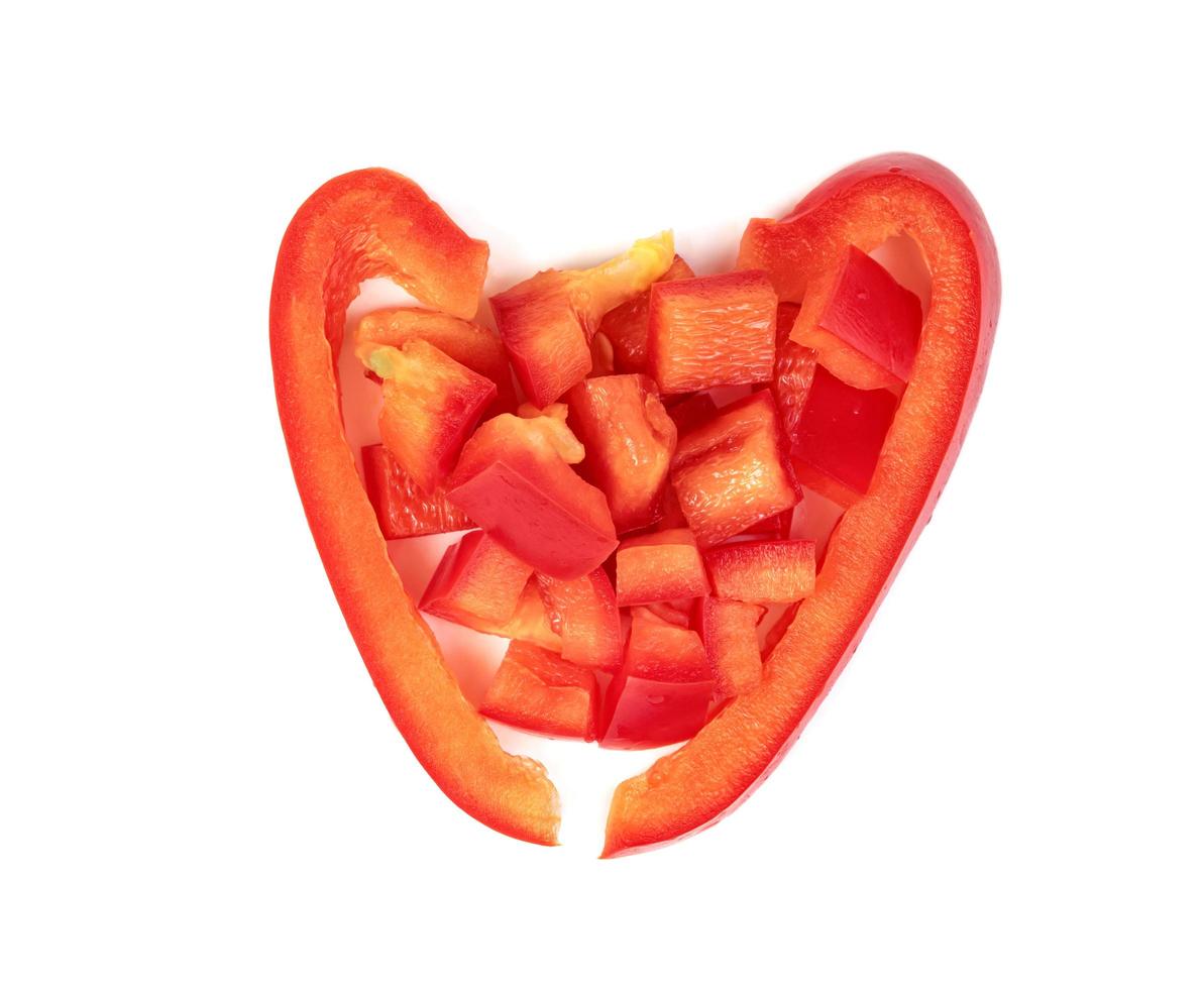red chopped sweet bell pepper isolated on white background photo