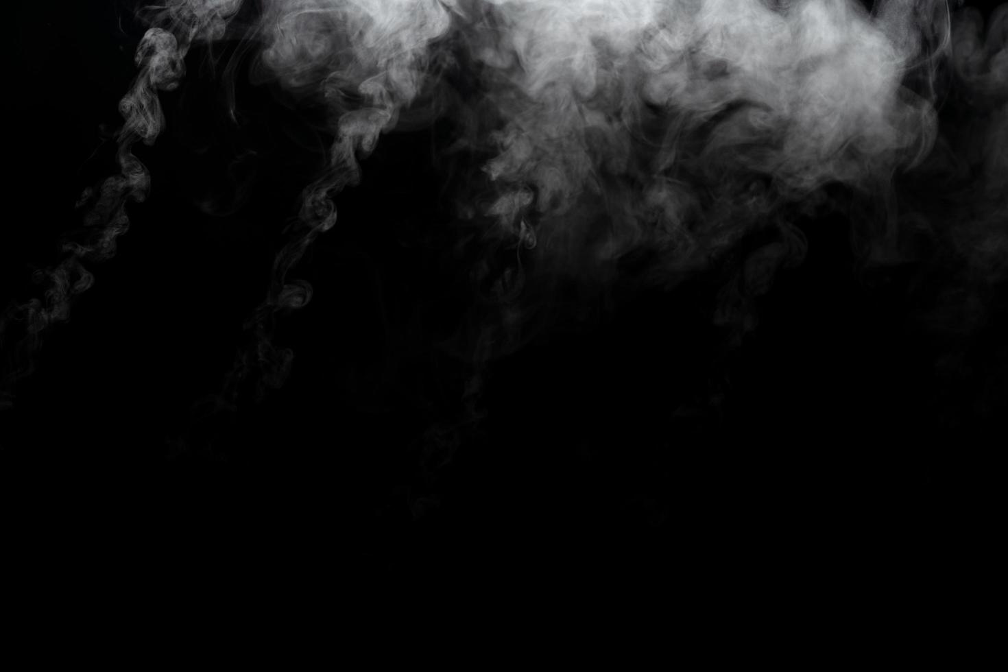 Abstract powder or smoke effect isolated on black background photo