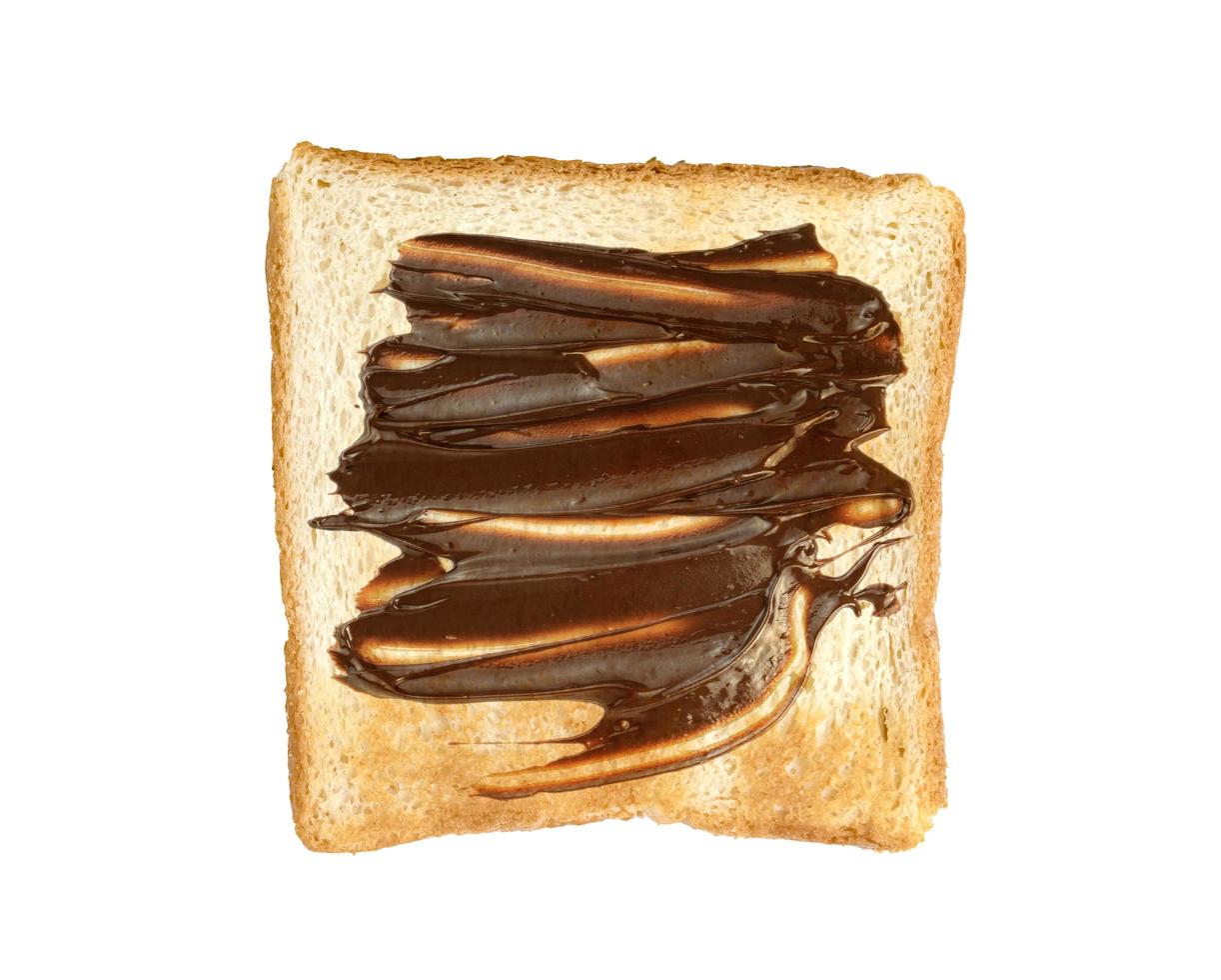 Toasted slice bread with chocolate spread isolated on white background photo