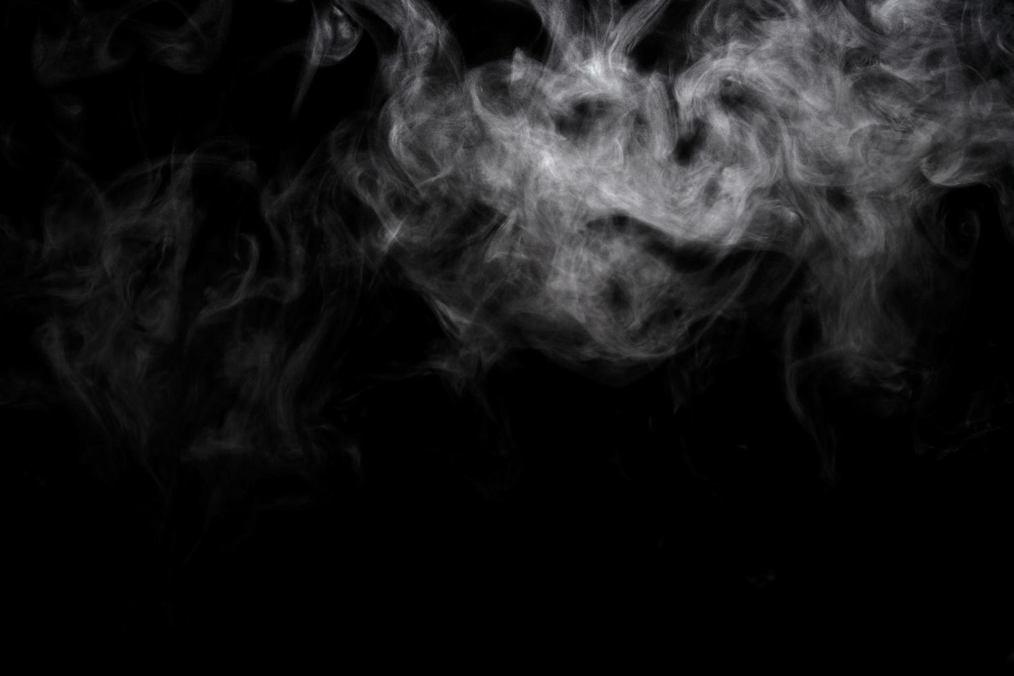 Abstract powder or smoke effect isolated on black background photo