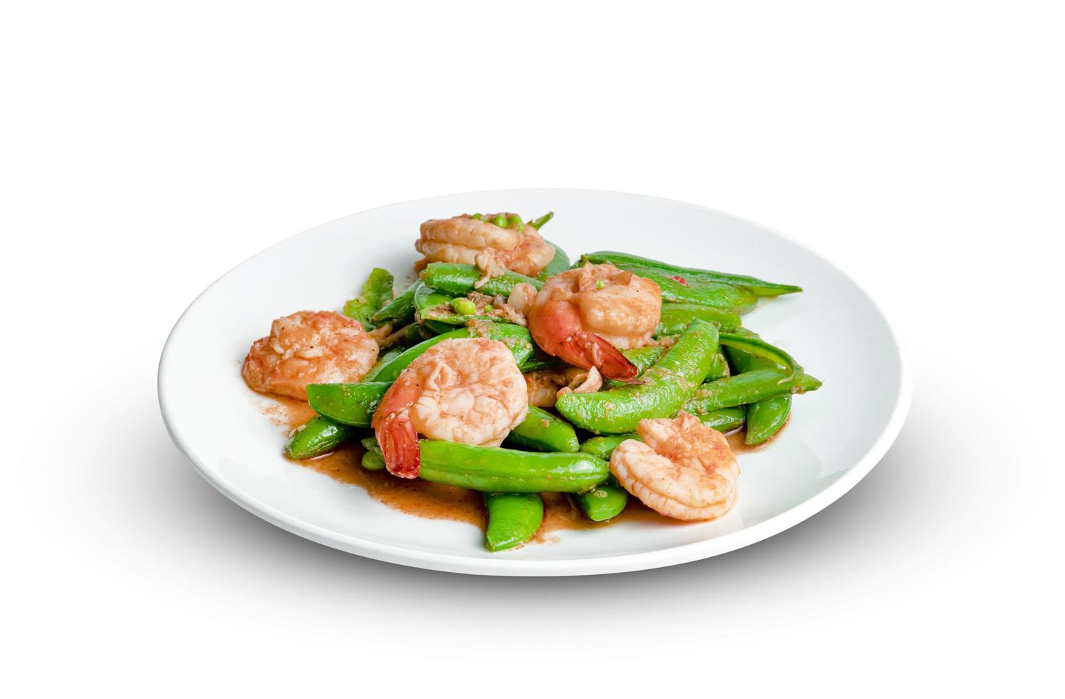 Stir fried green peas with shrimp on dish isolated on white background photo