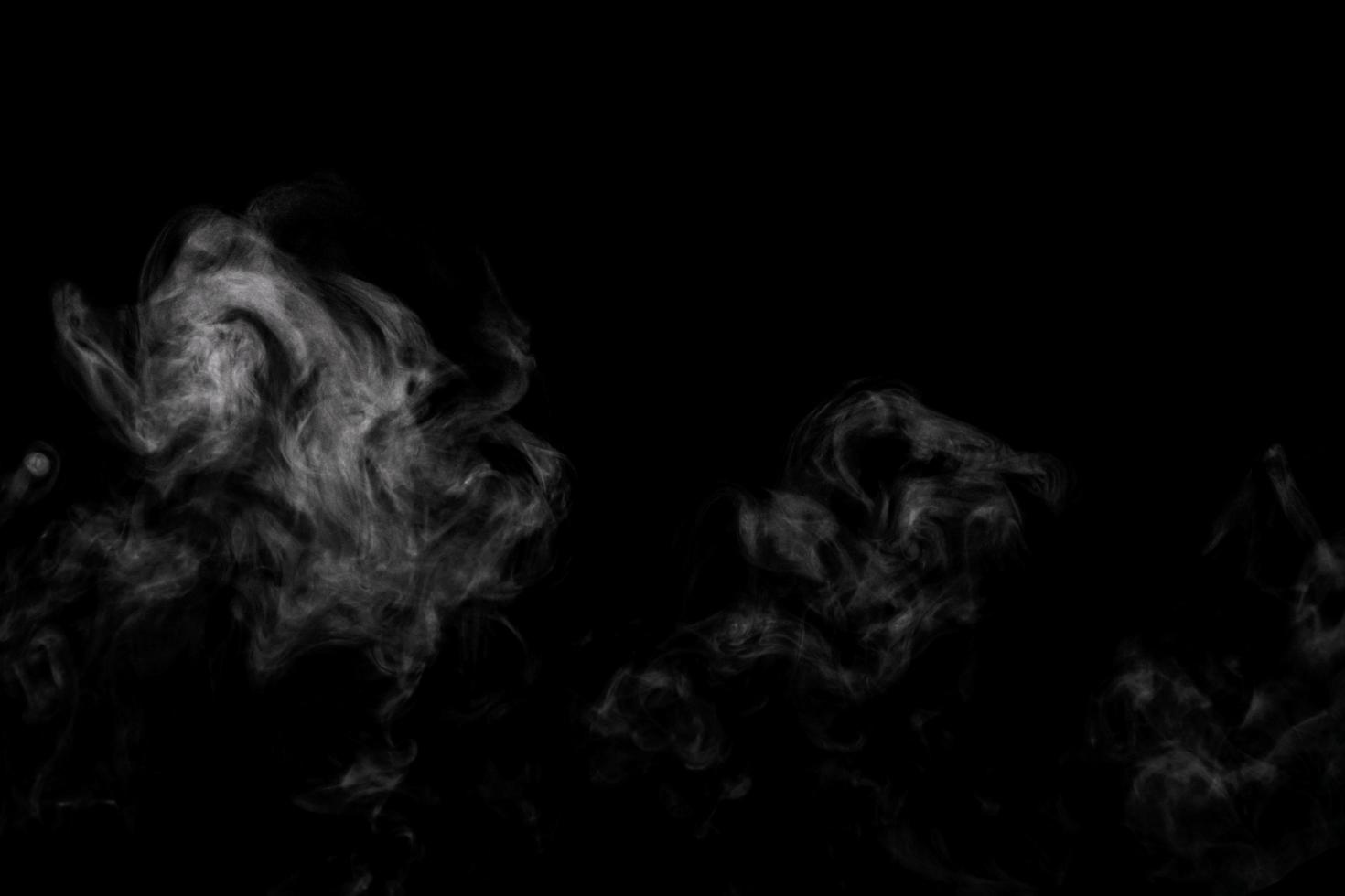 Abstract powder or smoke effect isolated on black background photo