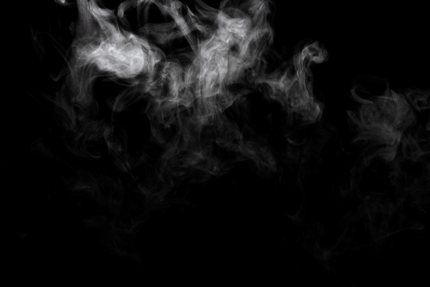 Abstract powder or smoke effect isolated on black background photo