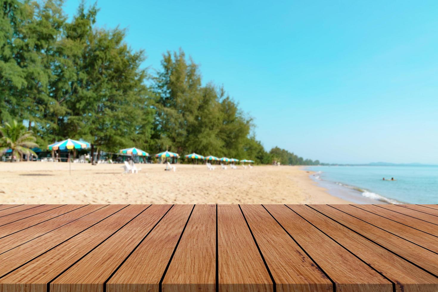 Wooden table with beach landscape blur Background photo