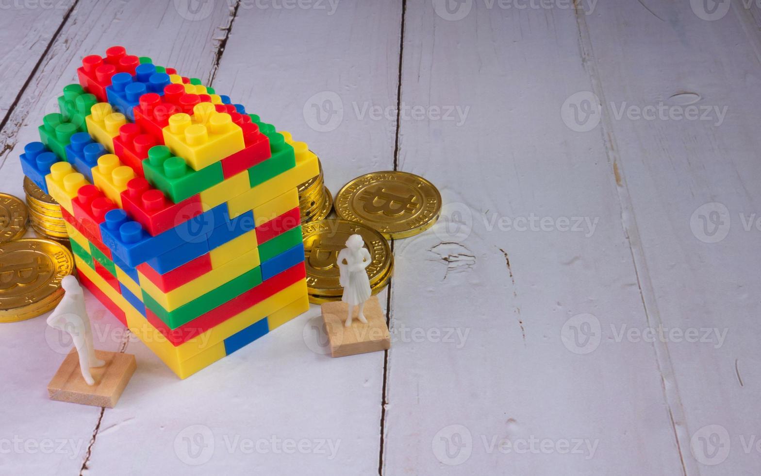 home multicolour toy brick and gold coins for kid or property business concept photo