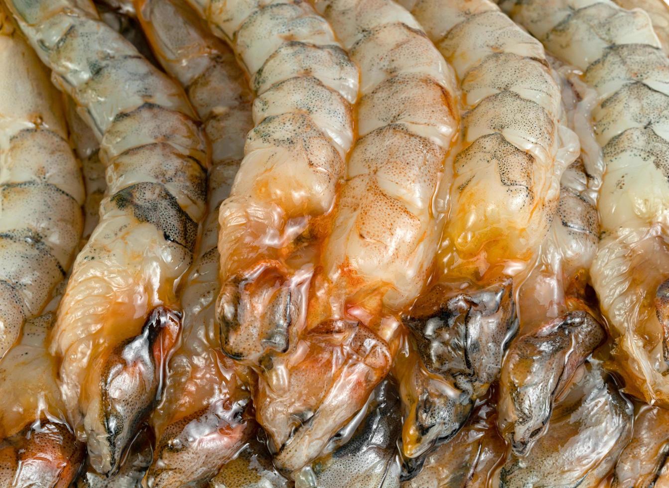 close up peeled shrimp raw isolated on white background photo