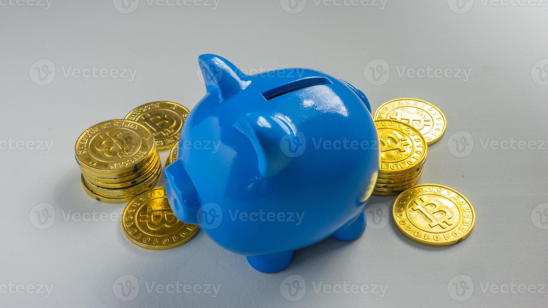 The blue piggy bank on white background for saving or business concept photo