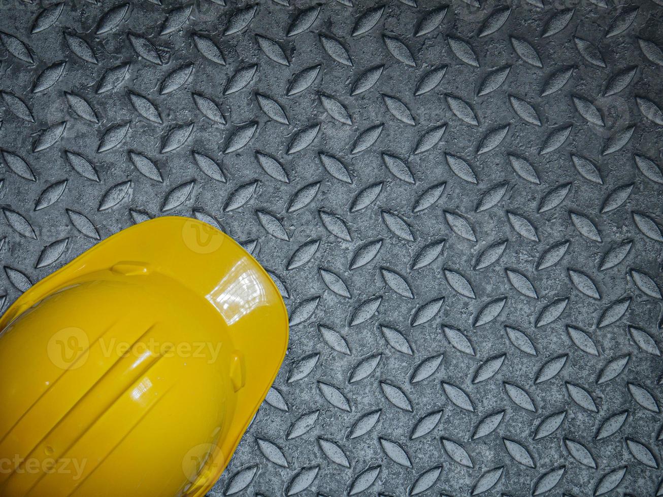 Hard Hats Yellow Cap Mine Safety Appliances on  Checker Plate photo