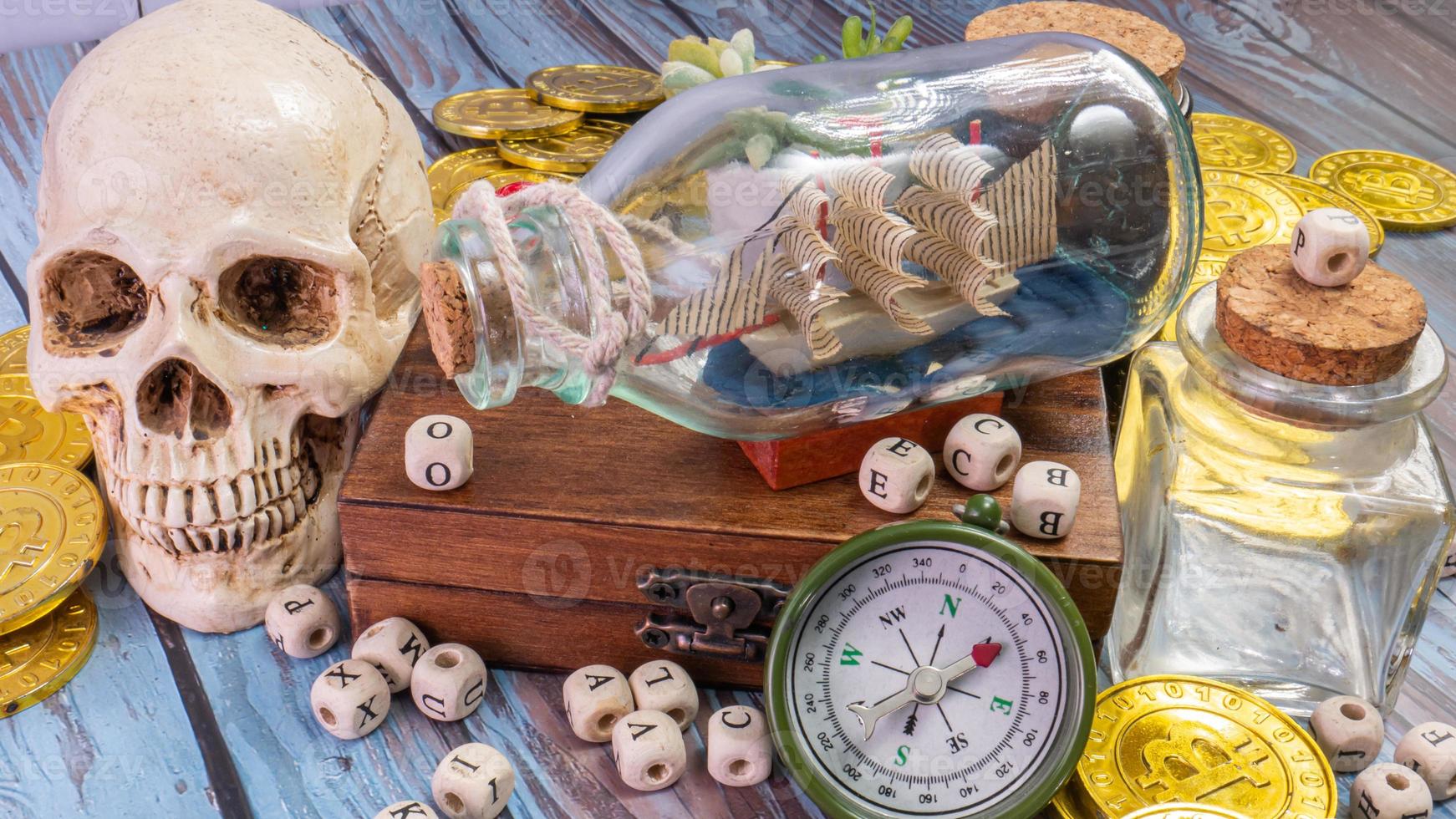 boat in  bottle on wood table for travel or transport concept photo