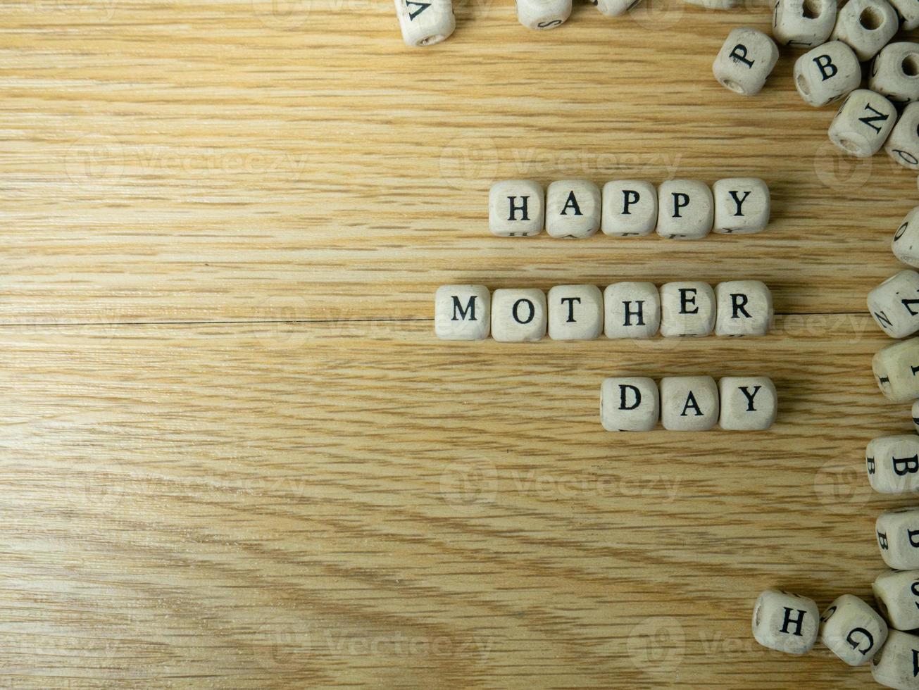 The wood cube word happy mother day for holiday concept photo