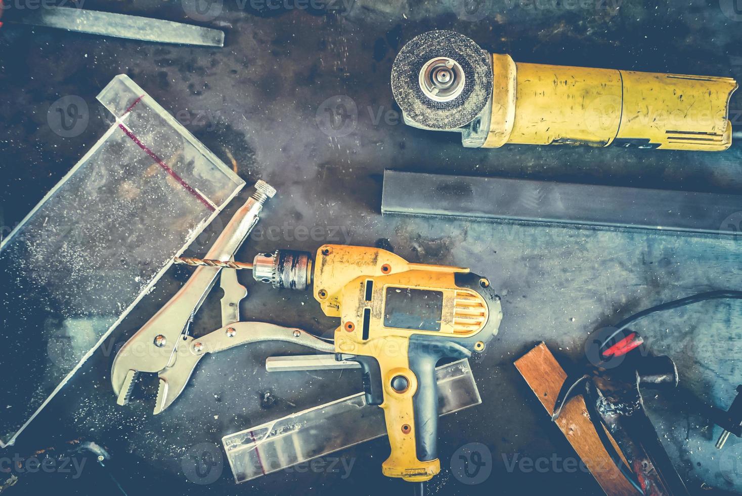 Many Tools on grunge table.View from above. Copy space. photo