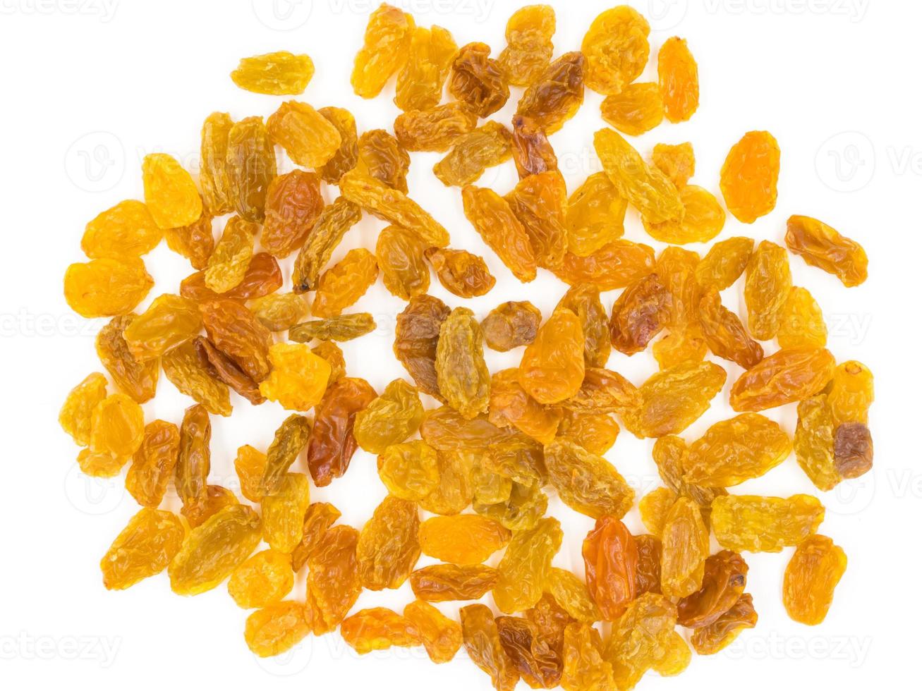 Yellow raisins on white background. photo