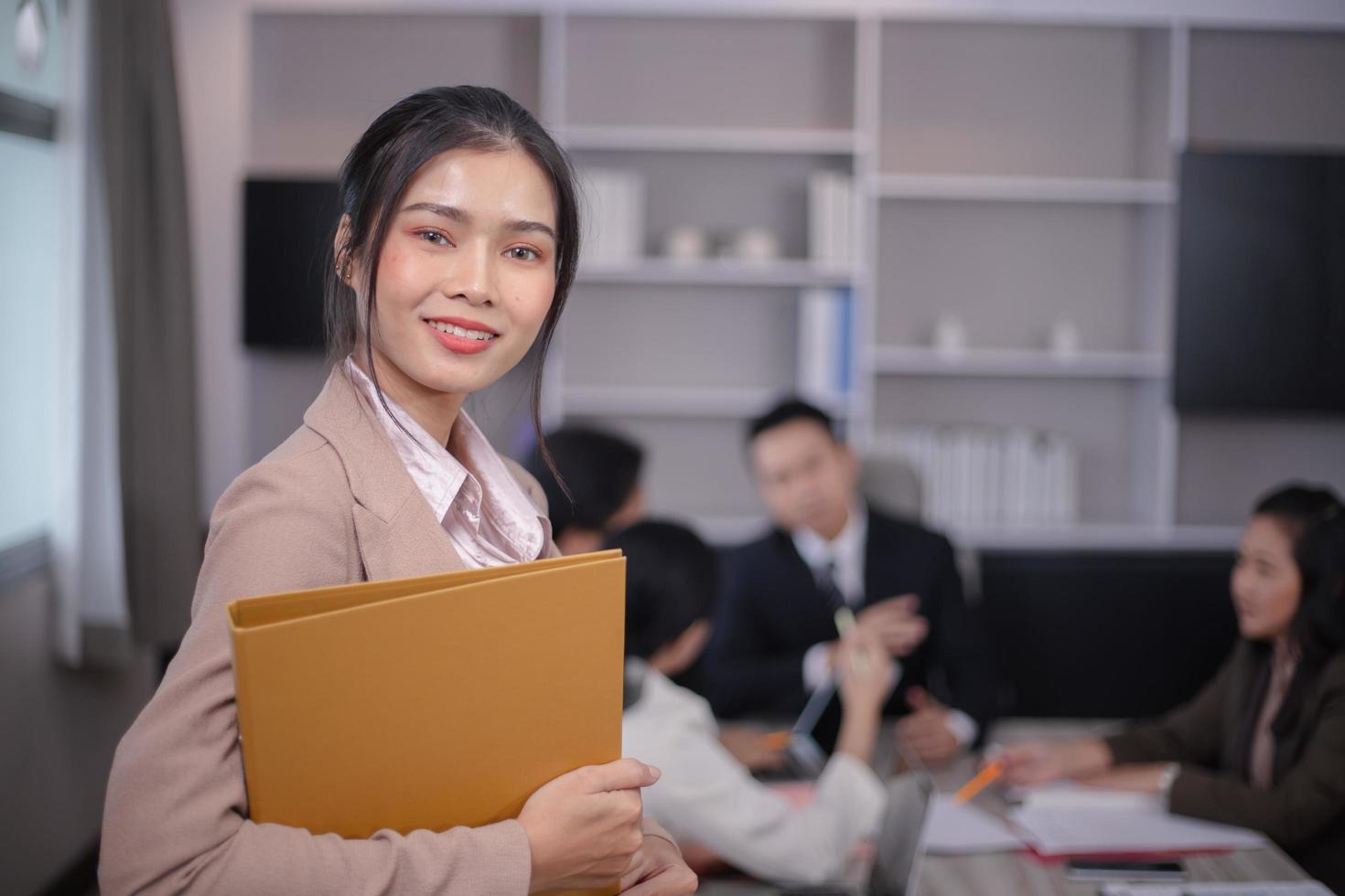 Portrait of a young confident female office manager at her workplace, ready for doing business task. photo