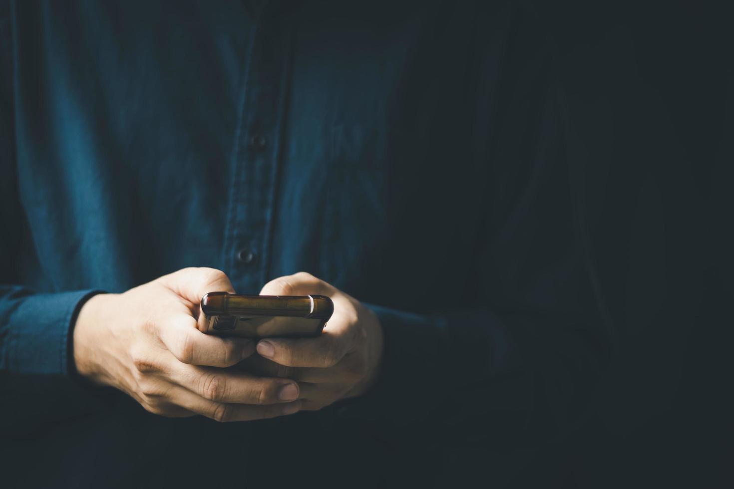 Social media technology concept, men's hands using smartphones to login social media, work from home or do online marketing. business and finance photo