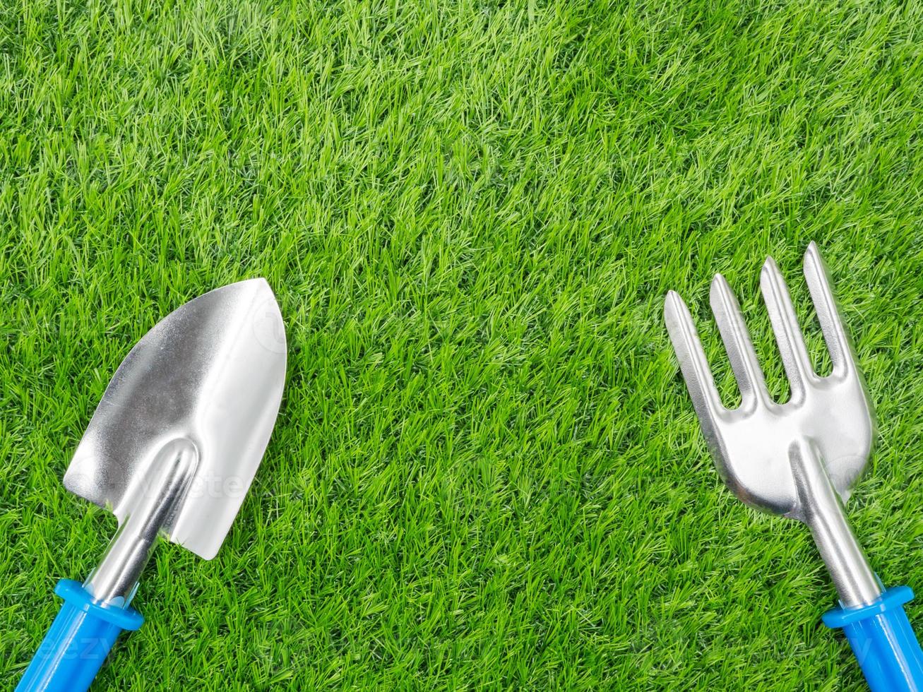 garden tools on grass background. photo