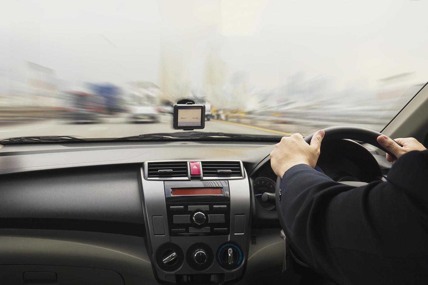 Business man is speedily driving a car photo