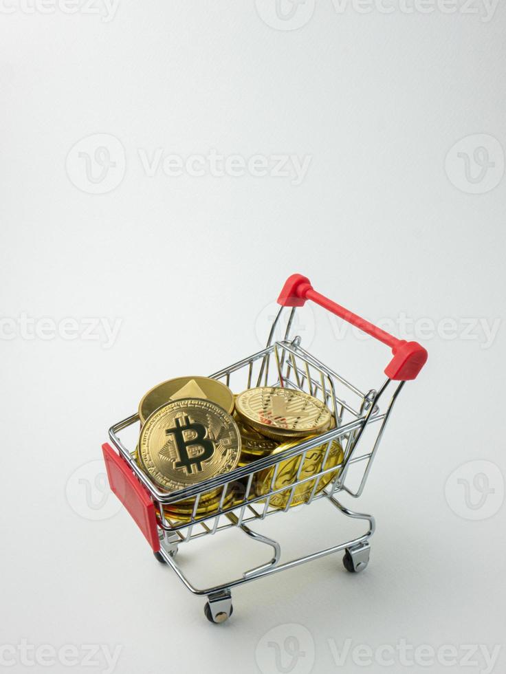 The bitcoin and other token on shopping cart for cryptocurrency or technology  concept photo
