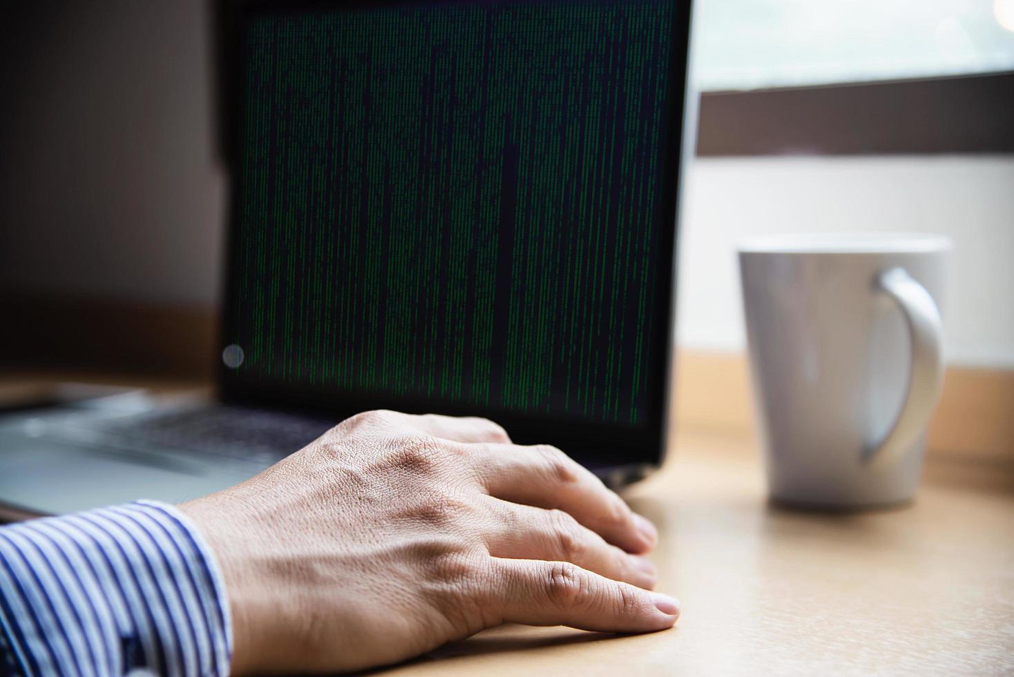 Businessman working with computer with coffee cup in the hotel room - people working lifestyle concept photo