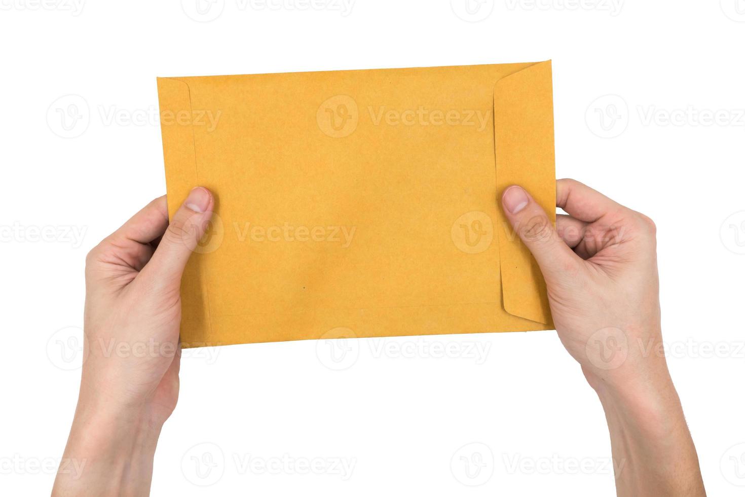 Hands holding envelope isolated on white background. photo