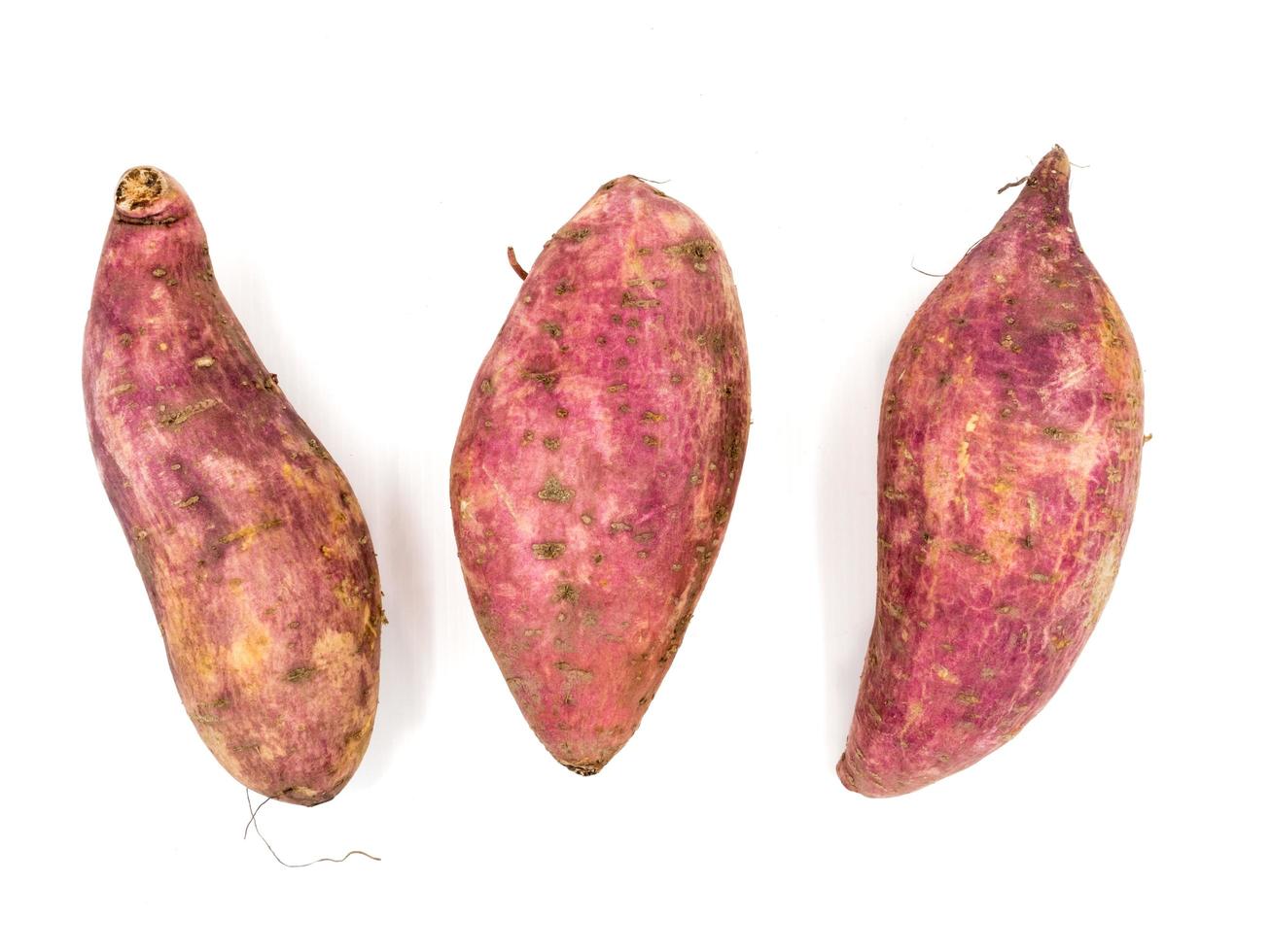 sweet potatoes on the white background photo