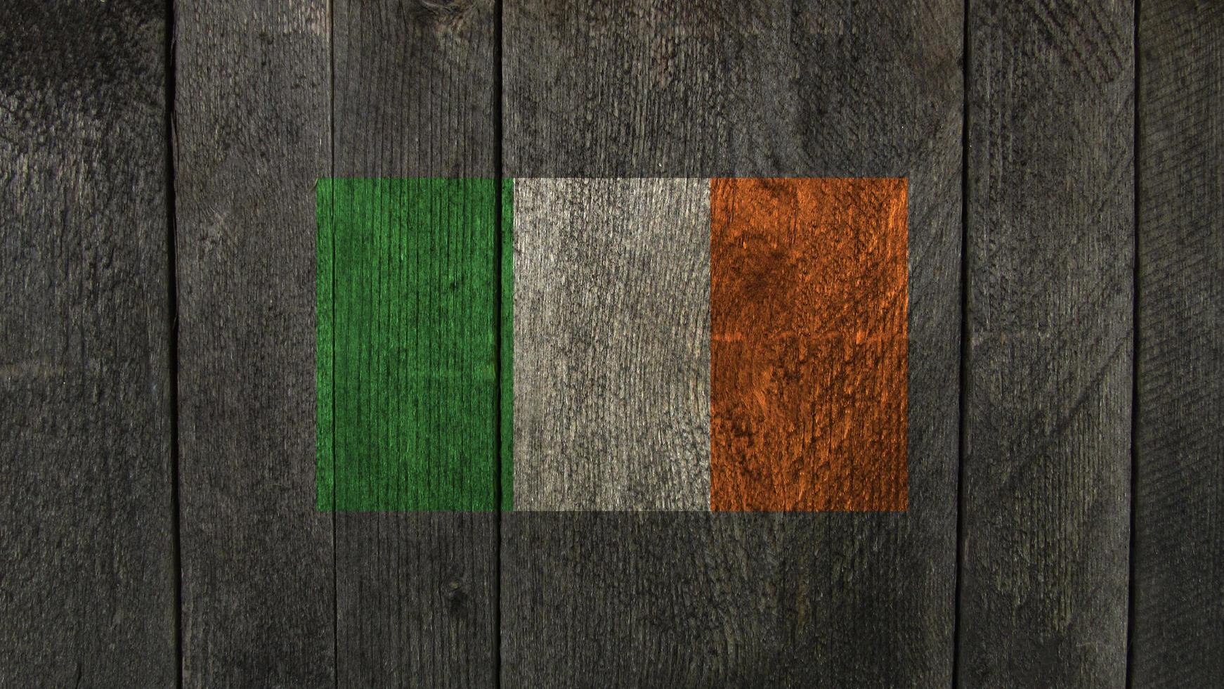 Ireland flag. Ireland flag on a wooden background photo