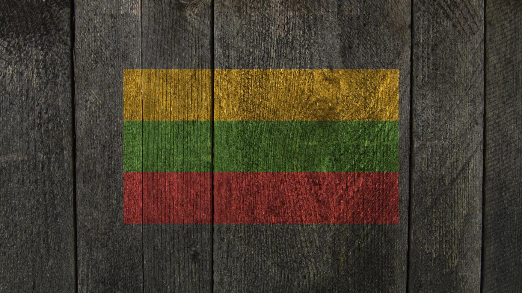 Lithuania flag. Lithuania flag on a wooden background photo