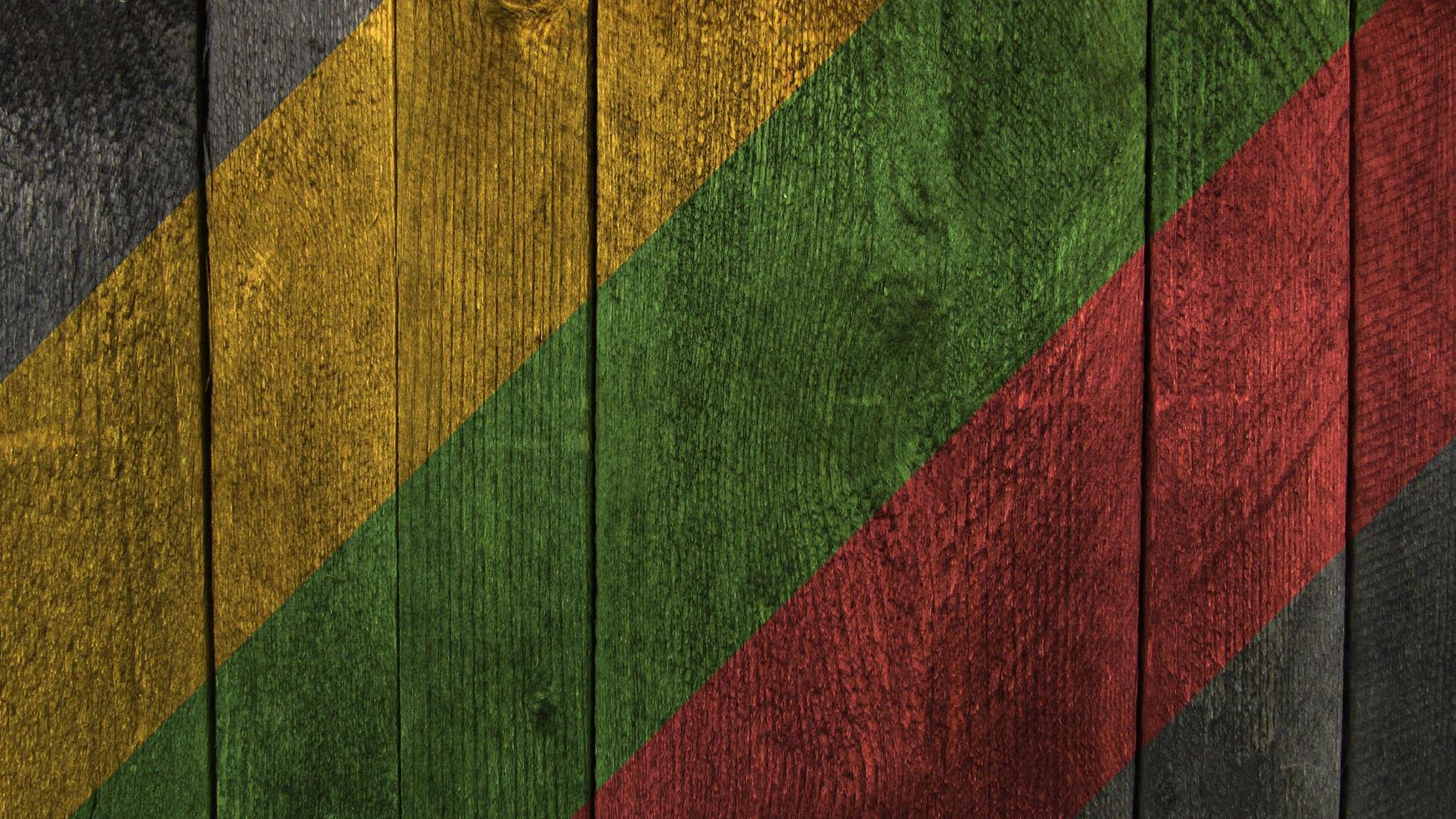 Lithuania flag. Lithuania flag on a wooden background photo