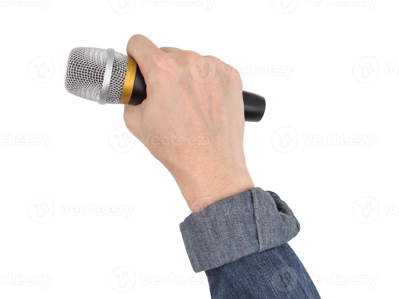 Male hand holding microphone on white background. photo