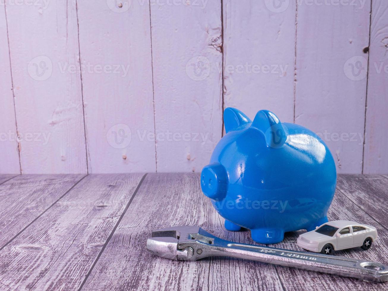 blue piggy bank and car for saving or car concept photo