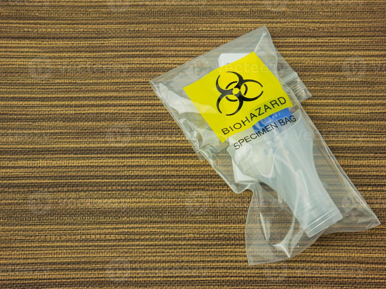 The  Antigen Test Kit in biohazard garbage for medical or sci concept photo