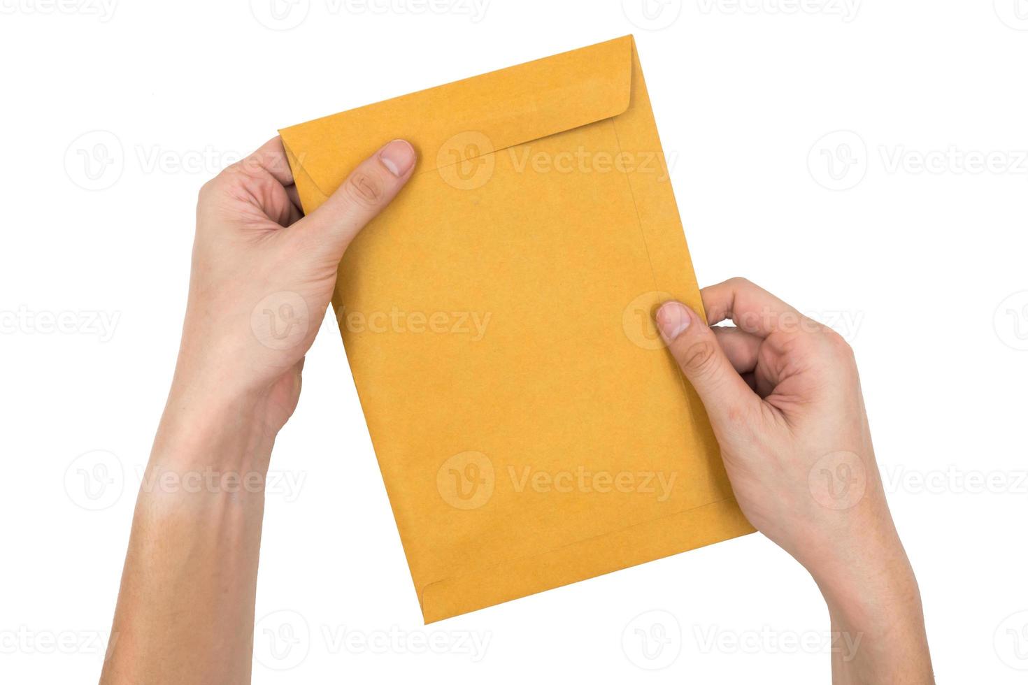 Hands holding envelope isolated on white background. photo