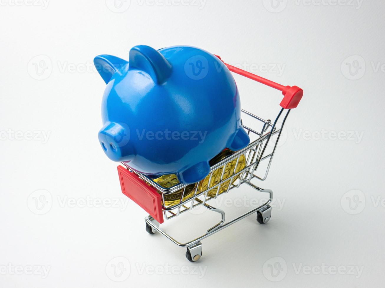blue piggy bank on shopping cart for business concept photo