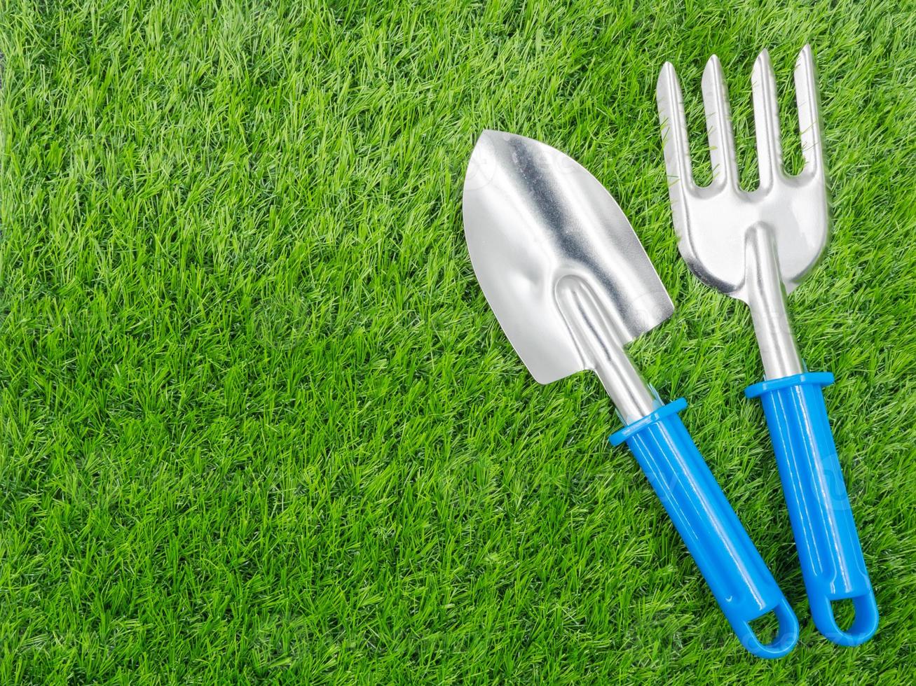 garden tools on grass background. photo