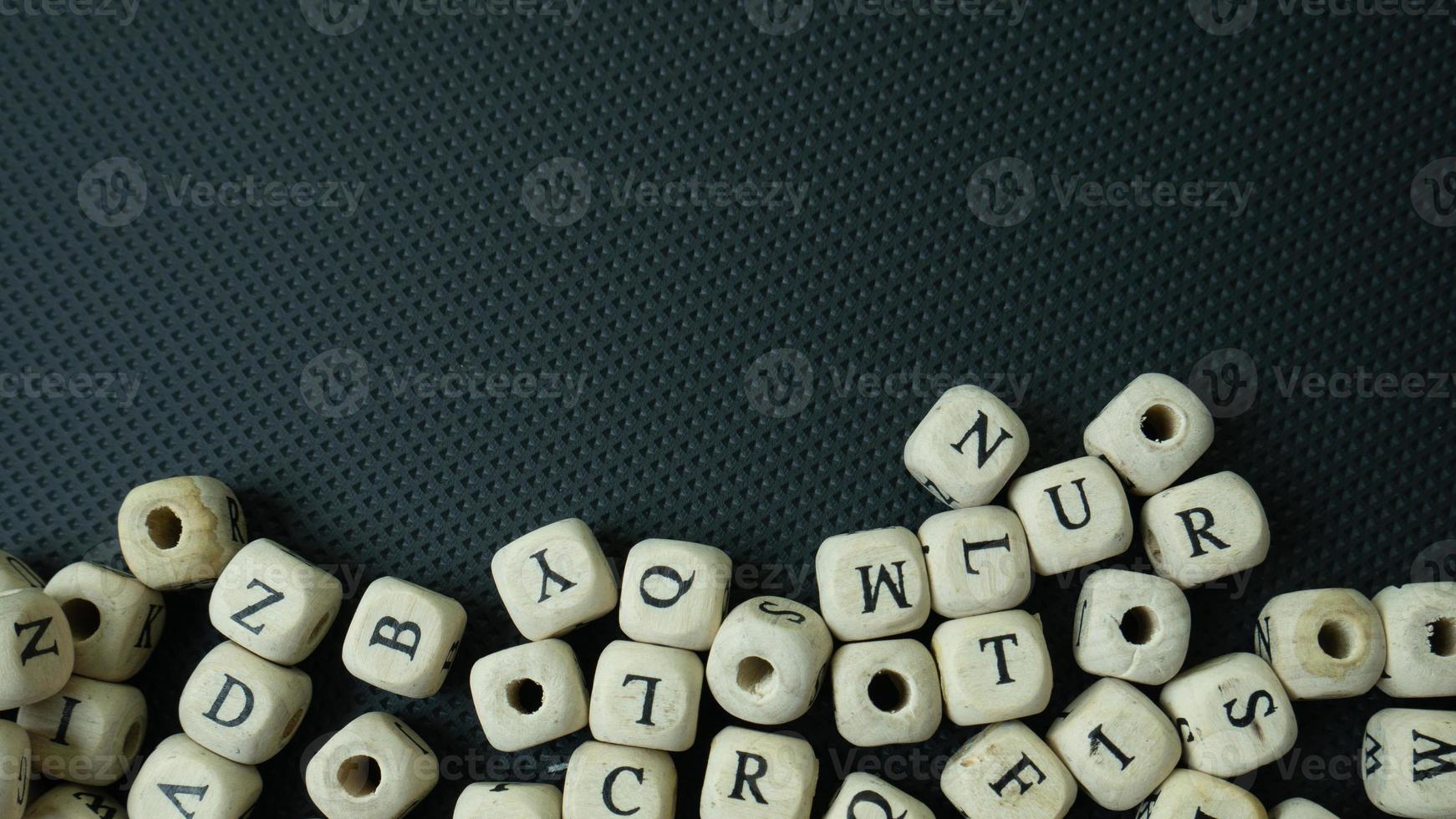 The alphabet wood cube on black background  for  education concept photo