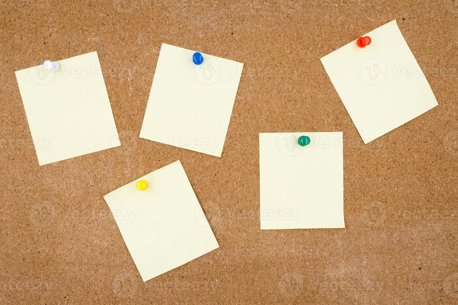 Blank papers pin up on cork board. photo