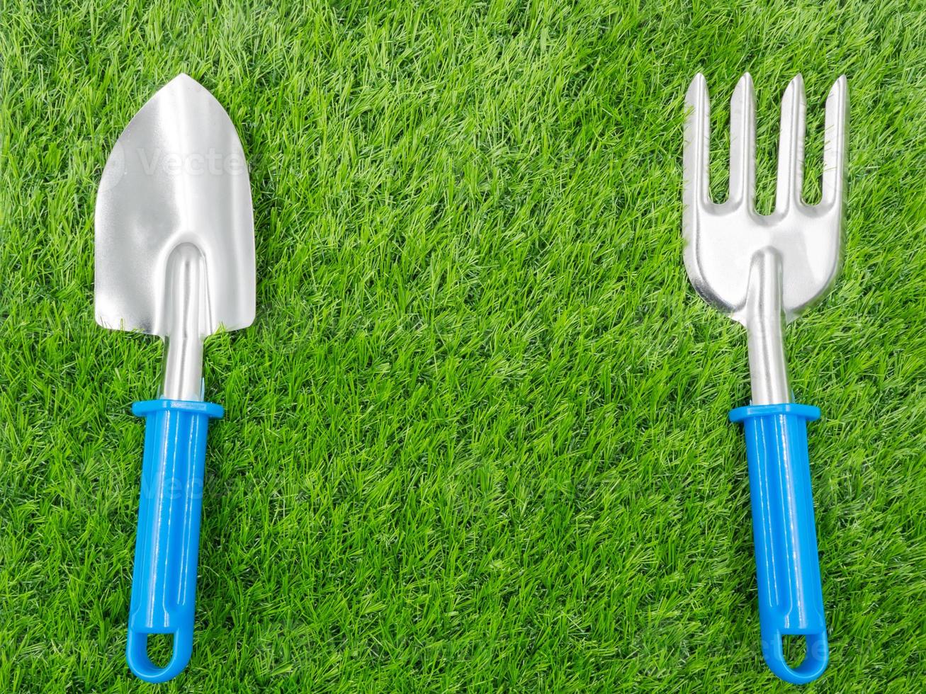 garden tools on grass background. photo